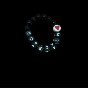 Handcrafted Bracelet "Forgiven and loved" with Black beads and red heart