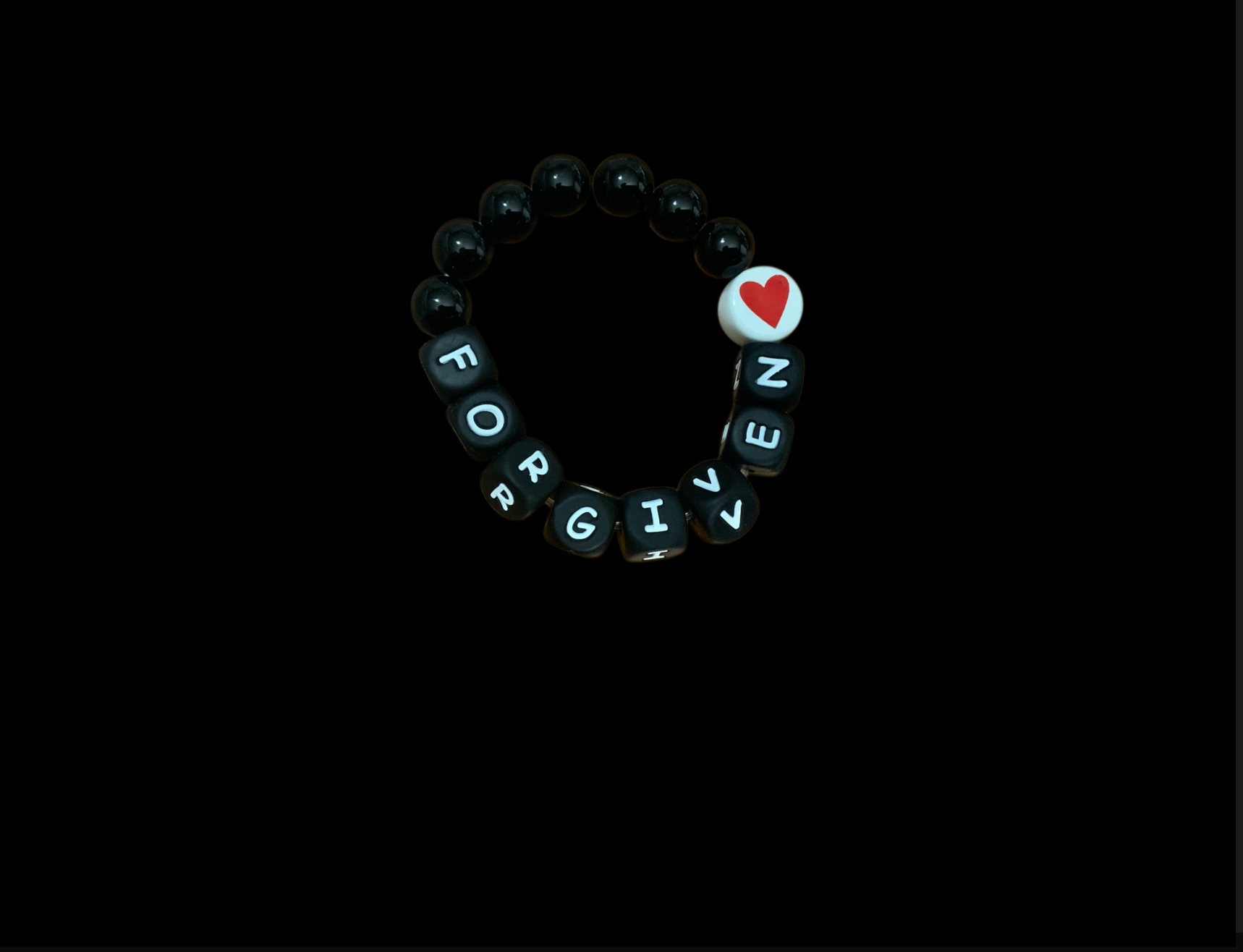 Handcrafted Bracelet "Forgiven and loved" with Black beads and red heart
